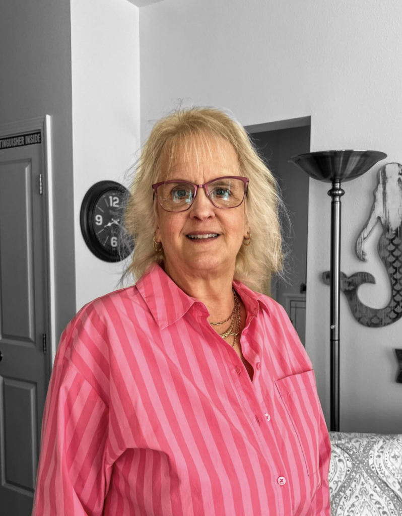 Portrait of author Julie Bailey Miller wearing a pink blouse